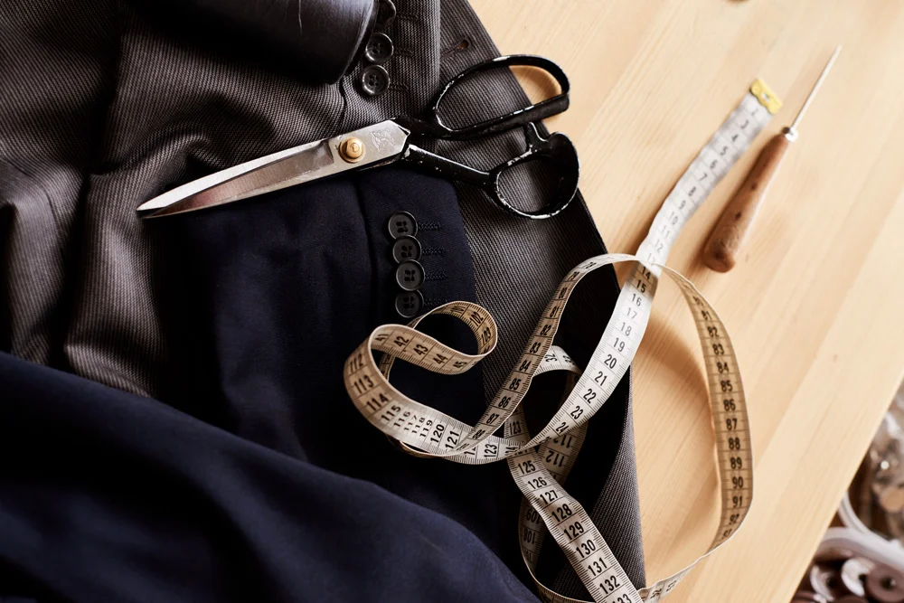 Worktable with fabrics and tailoring tools